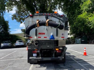 Public Works New Street Sweeper with Wondering Hose Attachment in the Rear