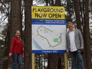District 1 Council Member Linley Jones and Mayor John Ernst at the new playground at Murphey Candler Park