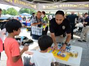 Sgt Nino with kids at national night out