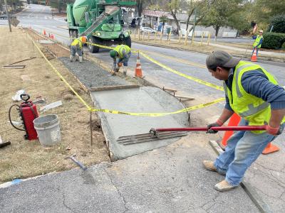 CONCRETE WORKERS REBUILDING AND INSTALLING ACCESSSABILITY RAMPS IN BROOKHAVEN.